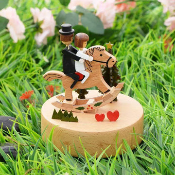 Wedding rocking horse wooden rotating music box featuring groom and bride figurines on rock horse table decoration