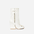 White leather wedge heel large size boots with chunky heel and zipper closure designed for easy wear