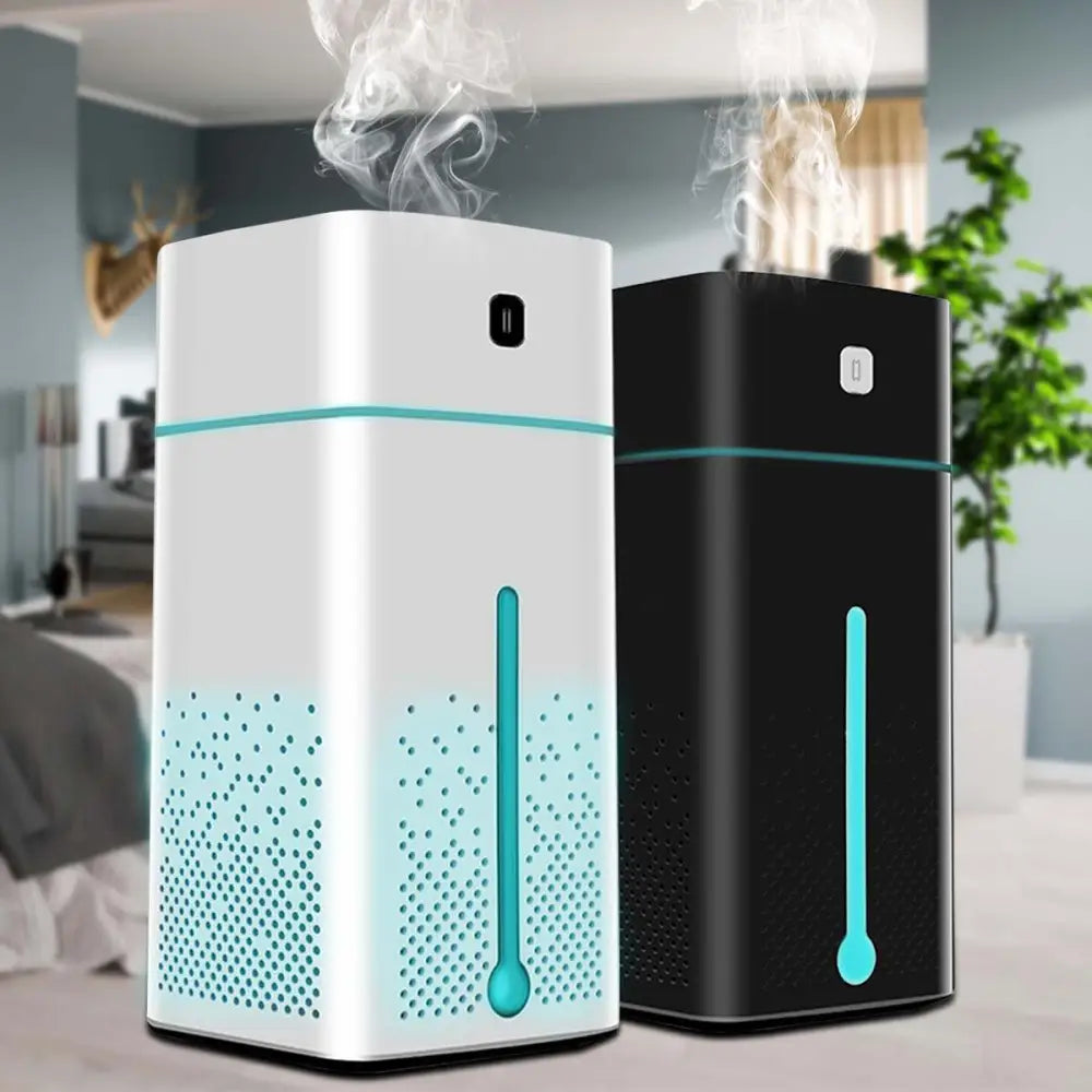 White and black air purifier humidifier with teal accents emitting mist in a white rectangular design