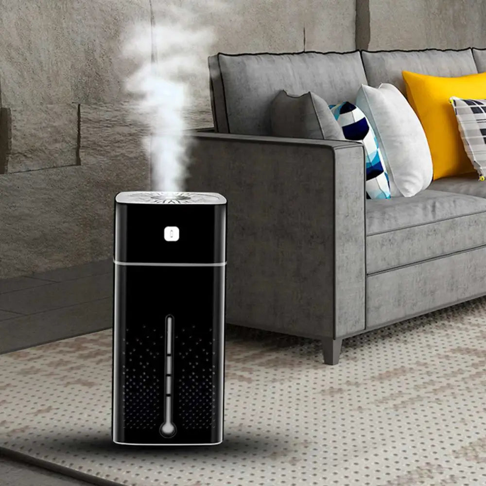 Black rectangular purifier humidifier with silver accent strip and teal control panel emitting mist from the top