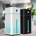 White and black rectangular purifier humidifier with teal accents emitting mist for improved air quality