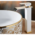 White and gold cold water waterfall basin faucet with sleek angular design and ornate modern details