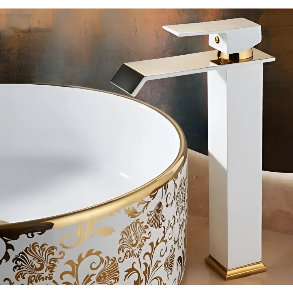 White and gold cold water waterfall basin faucet with sleek angular design and ornate modern details
