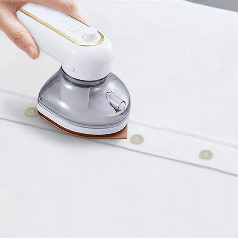 White and gold rechargeable portable iron with steam featuring a transparent water tank for efficient garment care