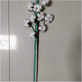 White artificial cotton stem with fluffy bolls and brown stalk showcasing realistic cotton flower branches
