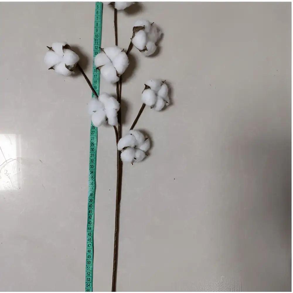 White artificial cotton stem with fluffy bolls and brown stalk showcasing realistic cotton flower branches
