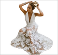 White backless sequin evening dress featuring a flowing white lace maxi design with deep v-neckline and floral pattern