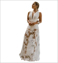 A flowing white lace maxi dress with deep v-neckline and sheer floral pattern for backless sequin evening wear
