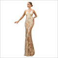 A shimmering gold lace mermaid gown with intricate floral embroidery and sheer overlay for backless sequin evening wear