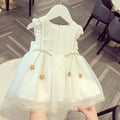 White beaded star baby gauze dress summer princess dress with ruffled shoulders and gold star charms at the waist