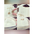 A white beaded star baby gauze dress with ruffled sleeves lace trim and gold star embellishments for dress summer princess look