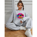 Gray oversized crew neck sweatshirt featuring a vibrant butterfly lips graphic with colorful paint splatter effects
