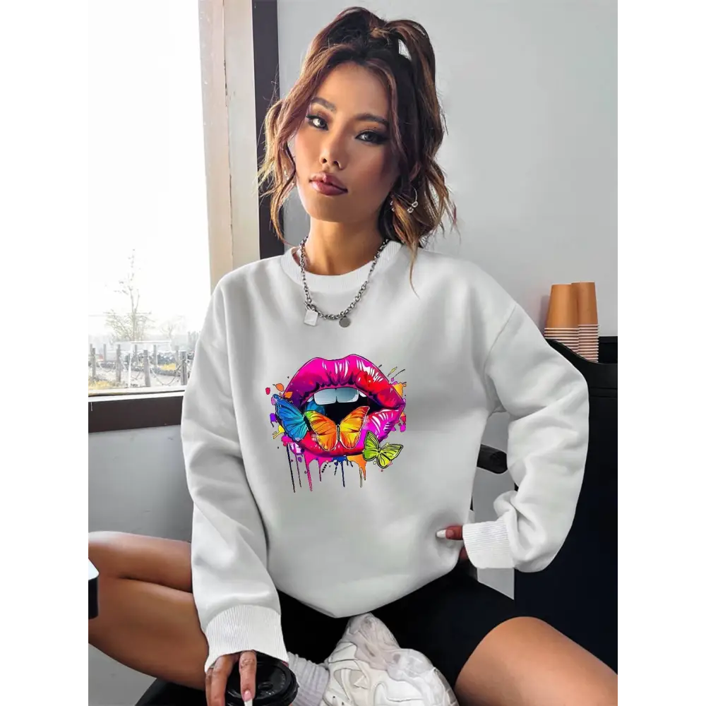 White crew neck sweatshirt featuring a vibrant butterfly lips graphic on the front for casual wear
