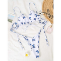 White butterfly print lace thong bikini set with adjustable string ties and blue butterfly print on white fabric