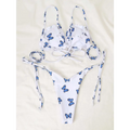 White butterfly print lace thong bikini with blue butterfly prints and ruffled straps in a white butterfly print swimsuit
