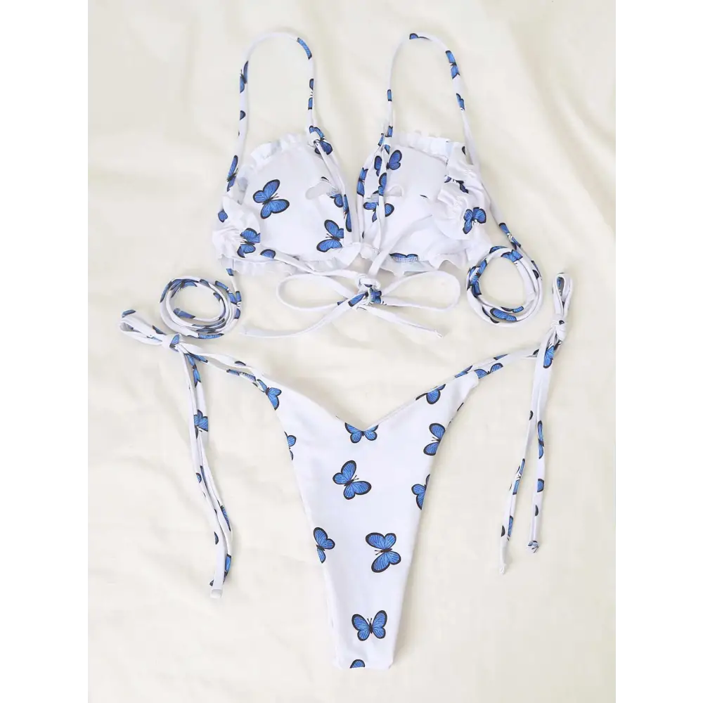 White butterfly print lace thong bikini with blue butterfly prints and ruffled straps in a white butterfly print swimsuit