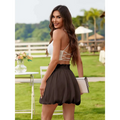 White casual graceful ruffled mini skirt with elastic waistband paired with white clutch with black trim