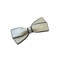 Cream-colored bow spring clip hairpin with black trim and glossy finish white ceramic camellia clip female hairpin