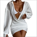 White chiffon long sleeve solid color mini dress with oversized button-down front and wrap-style skirt design