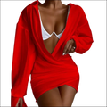 Vibrant red solid color long sleeve mini dress with a plunging neckline and asymmetrical hemline in wrap style