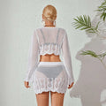 White crochet knitted beach bikini two-piece with scalloped edges geometric lace patterns featuring bell sleeves