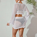 White crochet knitted beach bikini two-piece featuring bell sleeves and scalloped hemline for beachwear