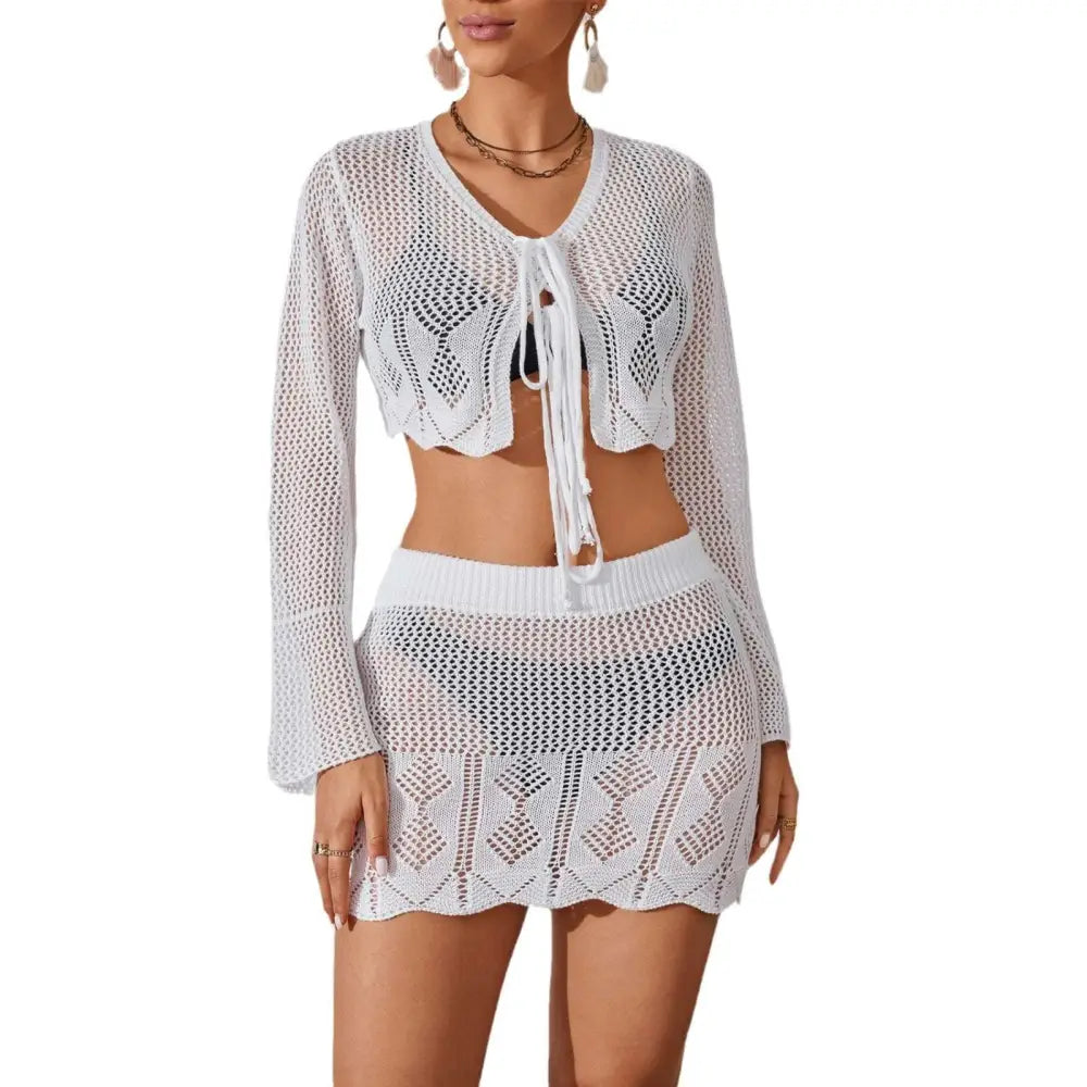 White crochet knitted beach bikini two-piece featuring bell sleeves and scalloped hem for stylish beachwear