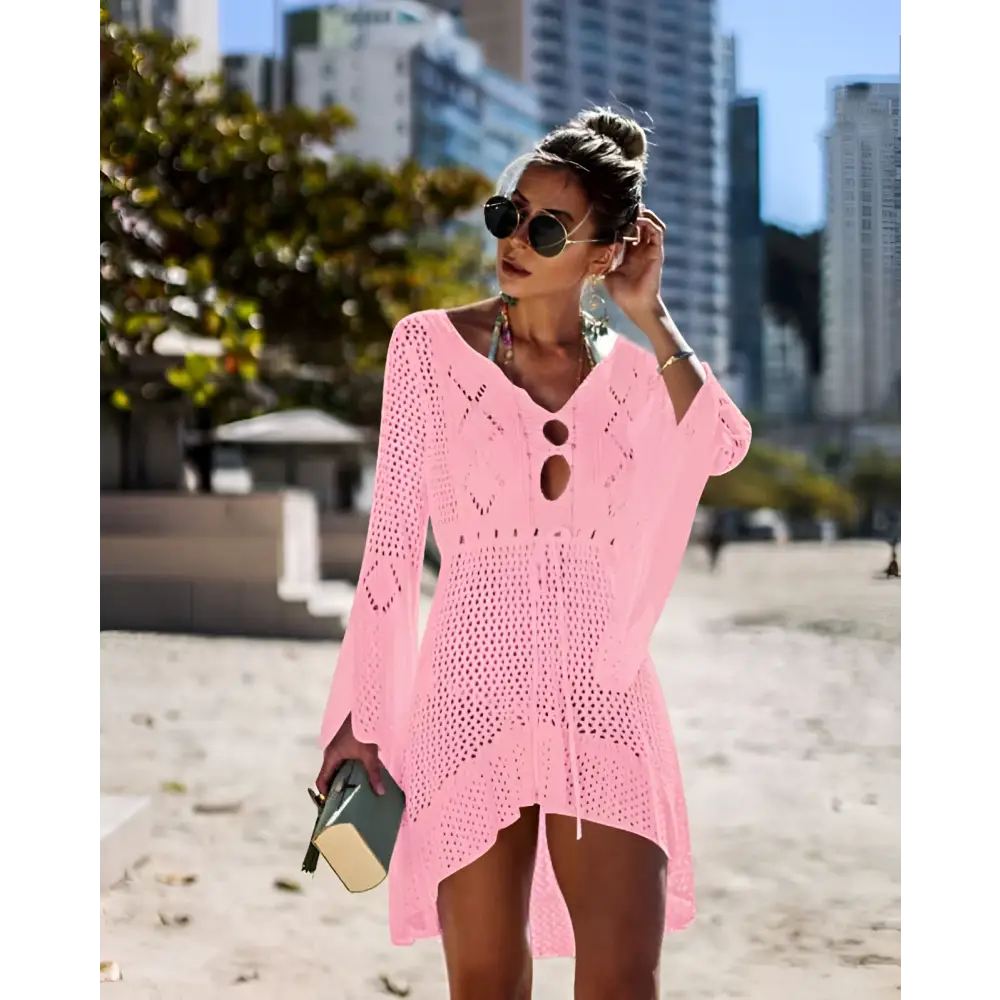 Pink long-sleeved crochet women swimsuit cover-up dress with v-neck and open side cutouts