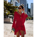 A vibrant red long-sleeved crochet women swimsuit cover-up dress with v-neckline and decorative buttons