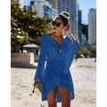 A vibrant blue long-sleeved crochet women swimsuit cover-up dress with v-neck and decorative cut-out details