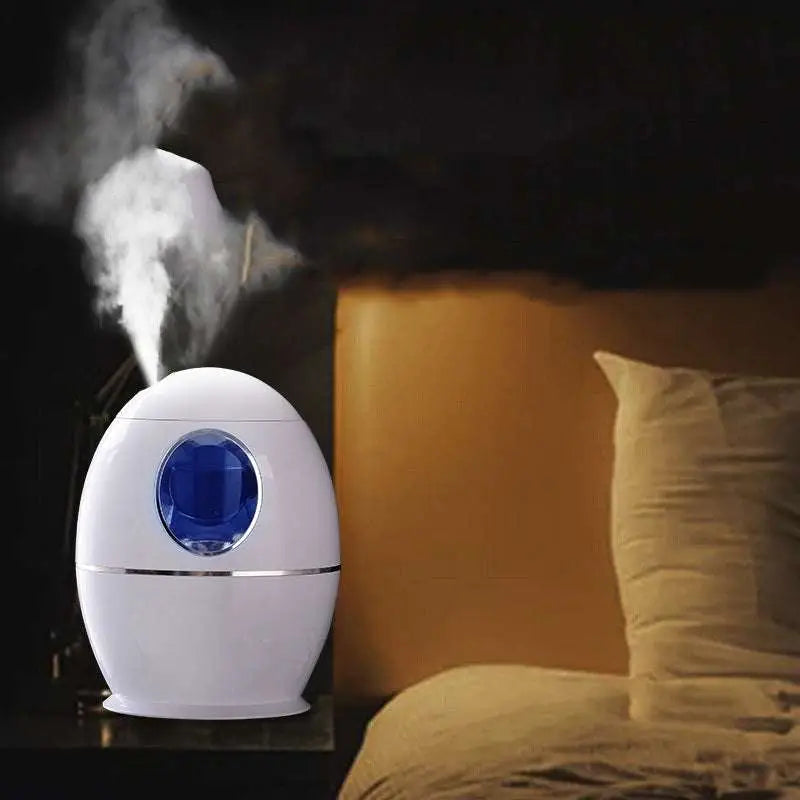 White egg aromatherapy humidifier usb rechargeable with glossy finish and blue-tinted circular window framed in silver