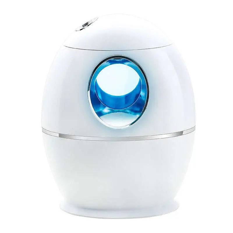 White egg aromatherapy humidifier usb rechargeable with glowing blue circular display and silver accent trim for home use
