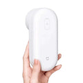 White xiaomi handheld electric bulb remover with sleek oval design and smooth plastic finish for luxury women’s fashion care