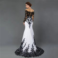 Black and white fishtail slim tail gown with white embroidered lace maxi detailing on back sleeves and hem