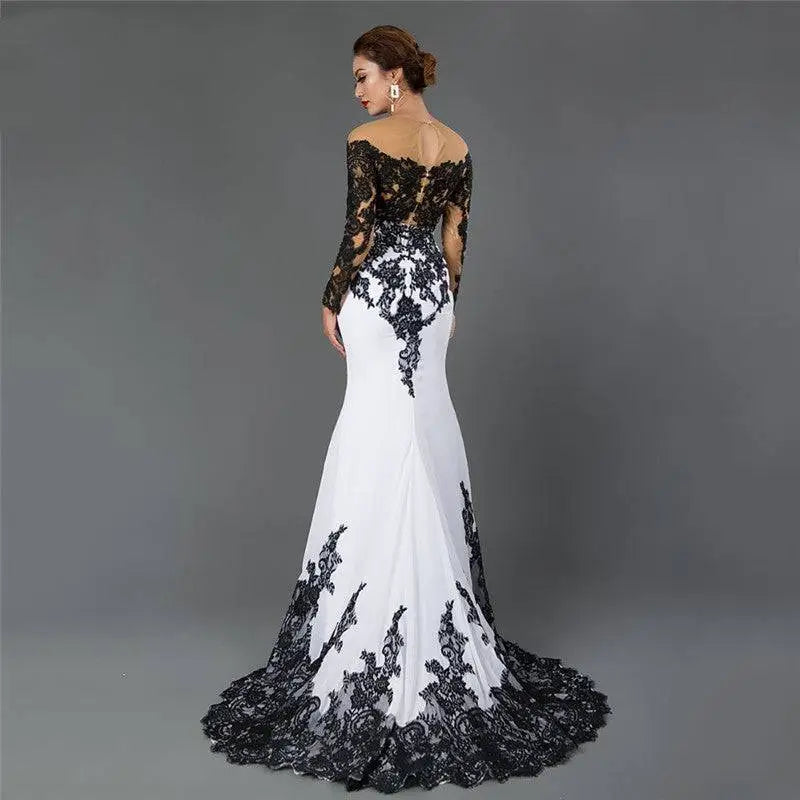 Black and white fishtail slim tail gown with white embroidered lace maxi detailing on back sleeves and hem