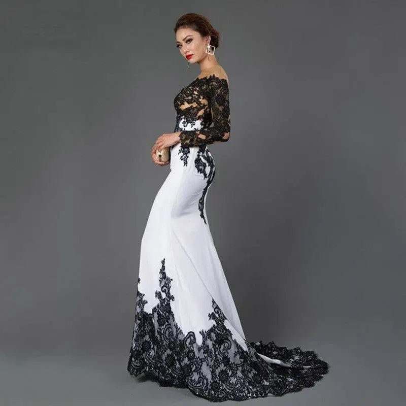 Elegant black and white fishtail slim tail gown with white embroidered lace maxi detailing on bodice sleeves and hemline