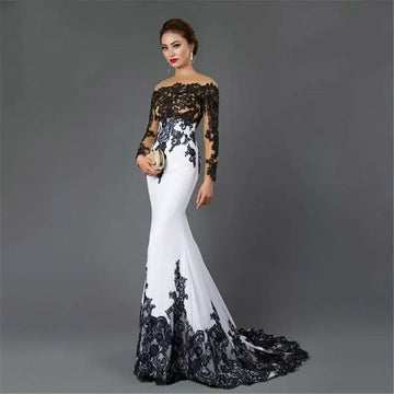 Elegant white embroidered lace maxi fishtail slim tail gown with off-the-shoulder black lace detailing on bodice sleeves hemline