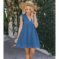 Blue eyelet summer sleeveless dress with v-neck and scalloped hem featuring white eyelet pocket detail