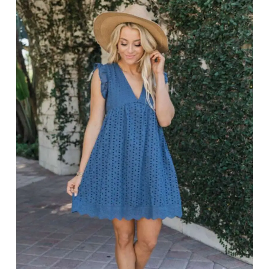 Blue eyelet summer sleeveless dress with v-neck and scalloped hem featuring white eyelet pocket detail