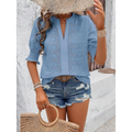 Light blue embroidered blouse with v-neck and three-quarter sleeves featuring puff sleeve and white eyelet details