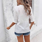 White eyelet blouse with delicate polka dots and puff sleeve ruffled three-quarter hollow hair ball design