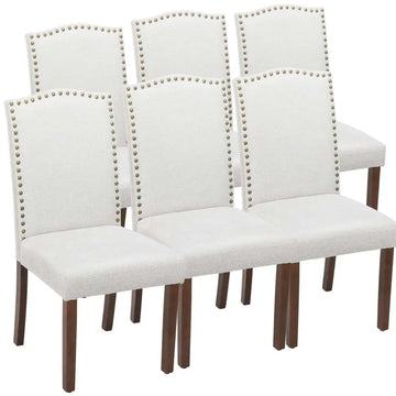 Set of six white fabric dining chairs with silver nailhead trim and dark wood legs dining chairs set