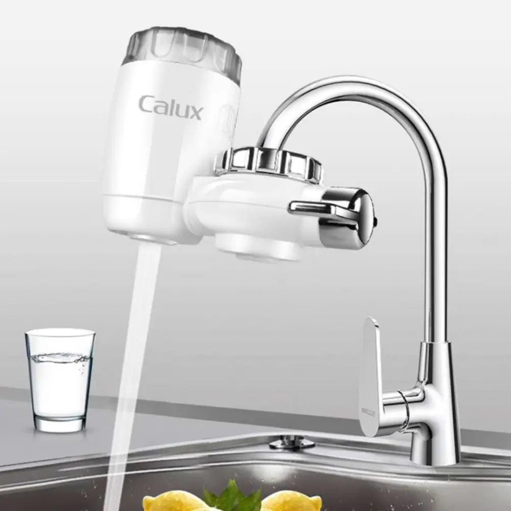 White calux faucet household kitchen front filter with transparent top and chrome accents for improved water quality