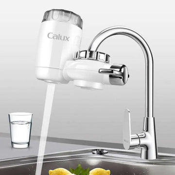 White calux faucet household kitchen front filter with transparent top and chrome accents for improved water quality