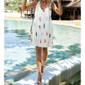 White feather printed fashion sleeveless lace dress with v-neckline and delicate lace trim on white fabric