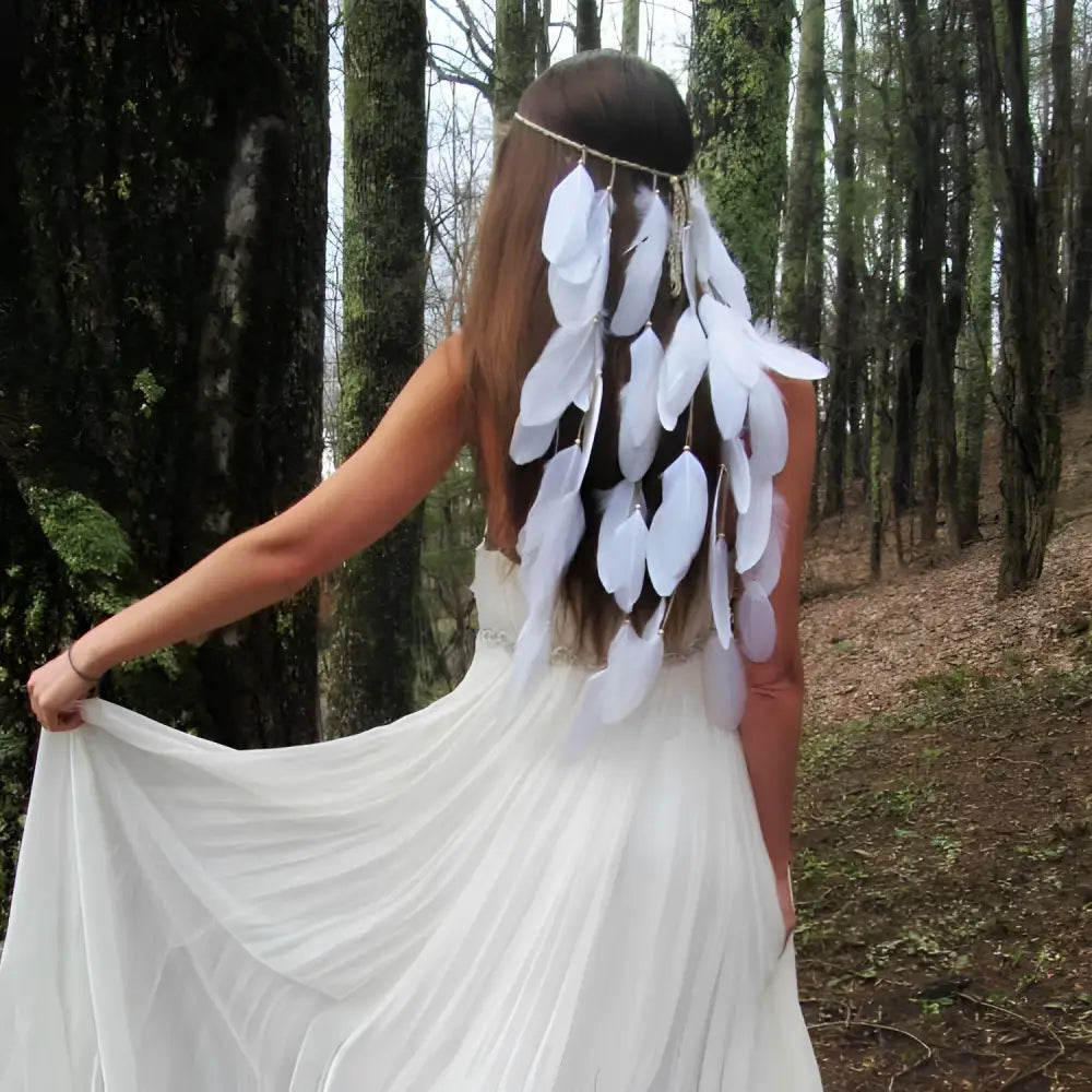White featherhead bohemia wedding bridal hair band featuring delicate cascading white feathers and a thin metallic band