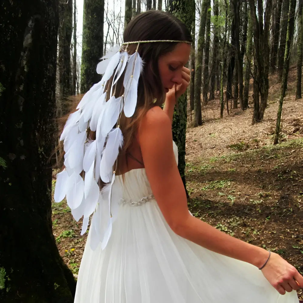 White featherhead bohemia wedding bridal hair band featuring delicate natural feather adornments in white color