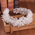 Delicate white floral crystal headband with intricate beaded lace design as elegant headband styling accessories