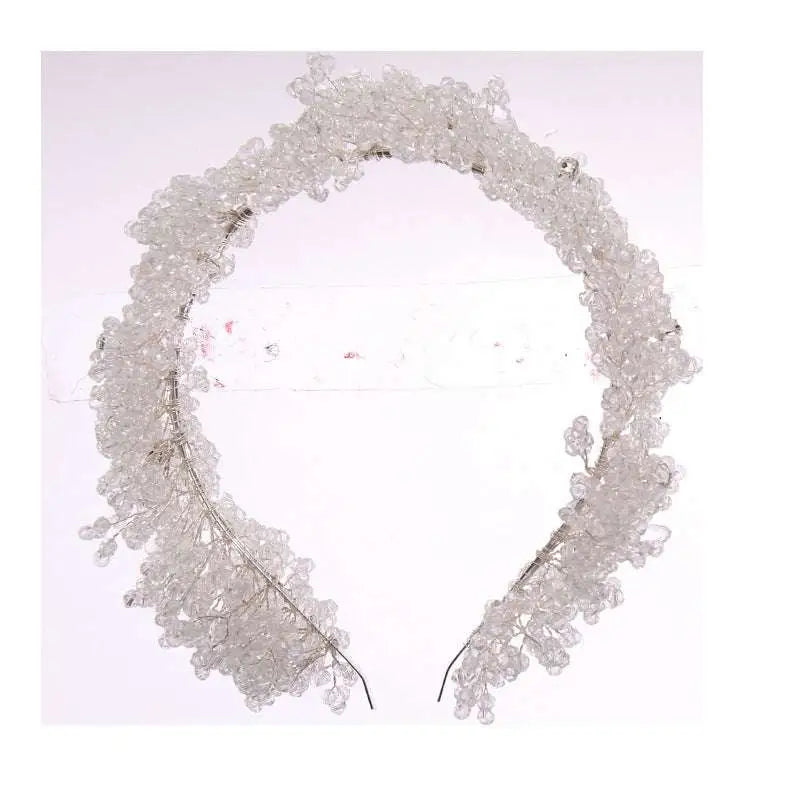 Delicate white floral crystal headband made of clear beads designed as headband styling accessories