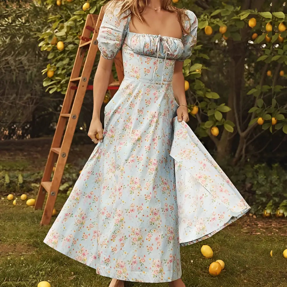 A light blue floral print dress for women featuring puff sleeves and a square neckline in a midi length